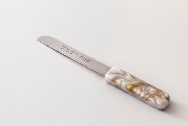 Pearl Gold challah knife with שבת ויום טוב  engraved.